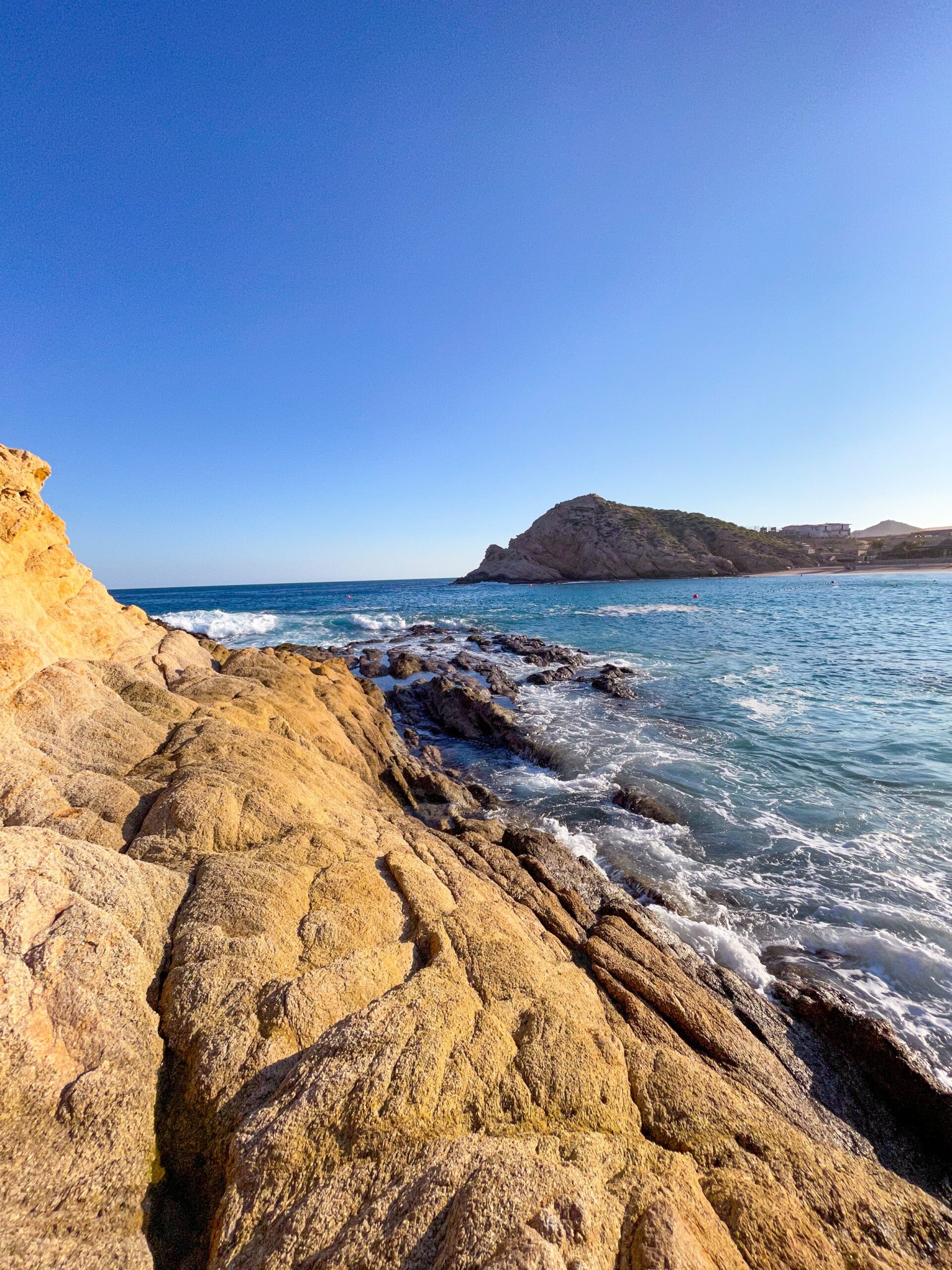 Sitting on the rocks at Playa Santa Maria.